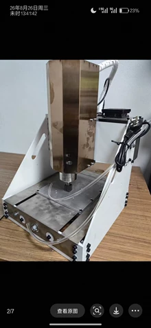 The desktop CNC engraving machine plus the fifth axis of the - Photo taken in person
